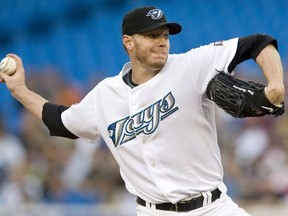 Toronto Blue Jays pitcher Roy Halladay works against the Tampa Bay Rays during first inning AL baseball action in Toronto on August 24, 2009. Former Toronto Blue Jays star pitcher Roy Halladay has died after his plane crashed in the Gulf of Mexico. He was 40.