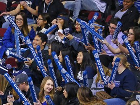 Mount Royal University Cougars fans cheer on their team during the Crowchild Classic at the Scotiabank Saddledome in Calgary, Thursday January 25, 2018.