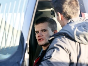 Calgary police arrest a suspect after he allegedly carjacked a vehicle in N.E. Calgary in a parking lot hitting multiply people and eventually being arrested outside of Calgary off of Highway 8 west of the city on Saturday January 6, 2018. Darren Makowichuk/Postmedia