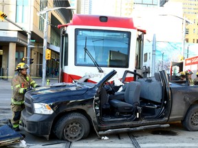 Crews clean up the scene of a mid-morning collision between a CTrain and a pickup truck at 1 St. and 7 Ave S.E.  on Saturday, Jan. 20 2018. Darren Makowichuk/Postmedia Network