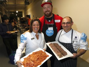 L-R, Carlene Donnelly, CUPS Executive Director, Spencer Wilson, Calgary Stampeders Offensive Lineman and David Flegel, Executive Chef of the Hyatt Regency Calgary were on hand as CUPS celebrated ìChristmas in Januaryî for those in need in Calgary on Tuesday January 16, 2018. Darren Makowichuk/Postmedia