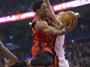 DeMar DeRozan tries to get past Kelly Olynyk as the Toronto Raptors take on the Miami Heat at the Air Canada Centre on Jan. 9, 2018