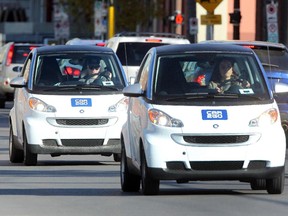 A couple of Car2Go vehicles are seen in the afternoon rush hour in downtown Calgary.