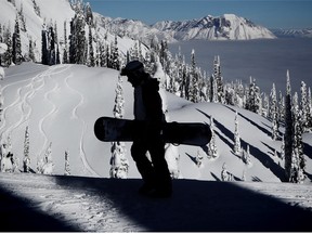 A snowboarder makes his way up Timber Bowl at Fernie Alpine Resort last Monday, the snowy resort will host Avalanche Awareness Days this weekend.