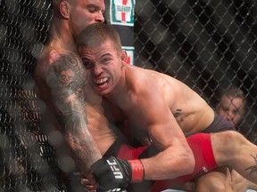 Alessandro Ricci, left, and Jeremy Kennedy fight during a lightweight bout at the UFC Fight Night event in Vancouver, B.C., on Saturday August 27, 2016. (THE CANADIAN PRESS/Darryl Dyck)