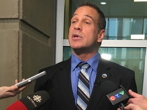 Sgt. Les Kaminski, president of the Calgary Police Association, speaks to media outside the Calgary Courts Centre on Jan. 8, 2018.