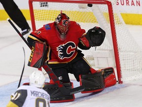 Vegas Golden Knights forward Jonathan Marchessault scores against Flames goaltender Mike Smith during NHL action at the Scotiabank Saddledome in Calgary on Tuesday, Jan. 30, 2018.