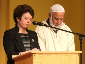 Minister Vicki McPhee and Imam Syed Soharwardy lead a prayer during a multi-faith service held at the Symons Valley United Chursh on Sunday, January 28, 2018.