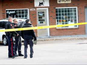 Calgary police investigate a shooting on the 4500 block of Bowness Rd. N.W. which sent a man to hospital were he died of his injuries on Saturday October 14, 2017. Darren Makowichuk/Postmedia