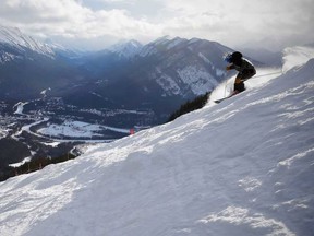 A skier enjoyed the sweet conditions with the townsite Banff in the background last weekend at Mount Norquay west of Calgary. Al Charest/Postmedia