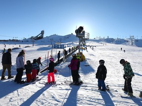 Calgarians at Canada Olympic Park on Wednesday were excited to hear WinSport announced it will be extending closing hours from 5 p.m. to 8 p.m. on Thursday and Friday this week for the ski and snowboard hill and Acura Tube Park. Photo by Darren Makowichuk/Postmedia.