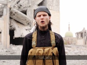 Dressed in the garb of the mujahideen, John Maguire is shown on six-minute video posted to YouTube - and later taken down - and linked on several jihadist websites. (YouTube Video Screenshot)