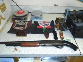 A shotgun and other items seized by Innisfail RCMP after a traffic stop on Dec. 28. Police handout photo