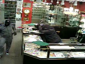 Calgary police released this surveillance camera image and a video in hopes the public can help them nab two robbers who held up an antiques store on Macleod Trail.