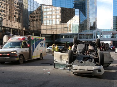 Calgary Police were called out to a vehicle rollover on 9th Avenue and 2nd Street SouthWest. The male driver was taken to hospital in life threatening condition. Wednesday, January 17, 2018. Dean Pilling/Postmedia