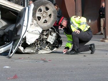 Calgary Police were called out to a vehicle rollover on 9th Avenue and 2nd Street SouthWest. The male driver was taken to hospital in life threatening condition. Wednesday, January 17, 2018. Dean Pilling/Postmedia