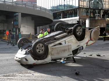 Calgary Police were called out to a vehicle rollover on 9th Avenue and 2nd Street SouthWest. The male driver was taken to hospital in life threatening condition. Wednesday, January 17, 2018. Dean Pilling/Postmedia