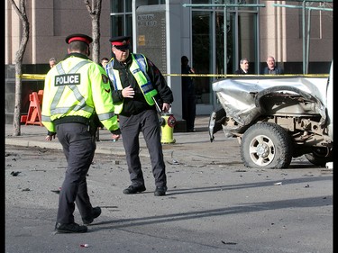 Calgary Police were called out to a vehicle rollover on 9th Avenue and 2nd Street SouthWest. The male driver was taken to hospital in life threatening condition. Wednesday, January 17, 2018. Dean Pilling/Postmedia