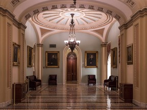 The corridors surrounding the U.S. Senate are empty on the first day of a government shutdown after a divided Senate rejected a funding measure, at the Capitol in Washington, Saturday, Jan. 20, 2018. (AP Photo/J. Scott Applewhite)