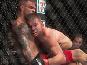 Alessandro Ricci and Jeremy Kennedy, right, fight during a lightweight bout in Vancouver on Aug. 27, 2016