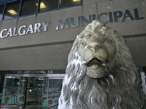 The lion in front of city hall is spattered with snow as the city announces its tax assessments for 2014 in Calgary, Alta., on Friday January 3, 2014. Mike Drew/Calgary Sun/QMI Agency