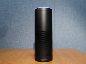 Amazon's Echo, a digital assistant that can be set up in a home or office to listen for various requests, such as for a song, a sports score, the weather, or even a book to be read aloud, is shown, Wednesday, July 29, 2015 in New York. The $180 cylindrical device is the latest advance in voice-recognition technology that's enabling machines to record snippets of conversation that are analyzed and stored by companies promising to make their customers' lives better. (AP Photo/Mark Lennihan)