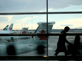Passengers commute at the Calgary International Airport.