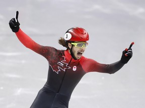 Samuel Girard celebrates his gold medal in the men's 1,000 metres at the Pyeongchang Olympics on Feb. 17.