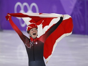 Kim Boutin celebrates her bronze medal in the women's 1,500 metres at the Pyeongchang Olympics on Feb. 17.