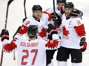 Canadian players celebrate a Chris Kelly (right) goal against the Czech Republic in the men's hockey bronze-medal game at the Pyeongchang Olympics on Feb. 24.
