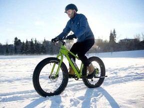 Tom Babin tries out the Surface 604 electric pedal-assist fat bike in Calgary, thanks to bike shop Power in Motion. (Leah Hennel/Postmedia)