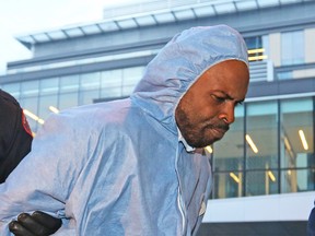 Police escort Edward Downey into the Court Services Section in downtown Calgary on Thursday July 14, 2016 after he was arrested in the murders of Taliyah Leigh Marsman  and her mother Sarah Baillie.