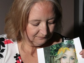 Judi Coyle holds a photo of her daughter, Kassidi (TRACY MCLAUGHLIN PHOTO)