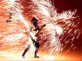 PYEONGCHANG-GUN, SOUTH KOREA - FEBRUARY 09:  Fireworks explode around a performer during the Opening Ceremony of the PyeongChang 2018 Winter Olympic Games at PyeongChang Olympic Stadium on February 9, 2018 in Pyeongchang-gun, South Korea.  (Photo by Lars Baron/Getty Images)