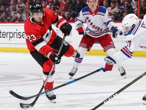 OTTAWA, ON - FEBRUARY 17:  Nick Shore #23 of the Ottawa Senators shoots the puck as Jesper Fast #17 of the New York Rangers makes a stick check in the second period at Canadian Tire Centre on February 17, 2018 in Ottawa, Ontario, Canada.  (Photo by Jana Chytilova/Freestyle Photography/Getty Images)