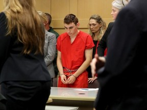 Nikolas Cruz appears in court for a status hearing before Broward Circuit Judge Elizabeth Scherer on February 19, 2018 in Ft. Lauderdale, Florida. Cruz is facing 17 charges of premeditated murder in the mass shooting at Marjory Stoneman Douglas High School in Parkland, Florida.
