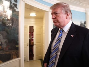 US President Donald Trump leaves after speaking on the Florida school shooting, in the Diplomatic Reception Room of the White House on February 15, 2018 in Washington, DC.