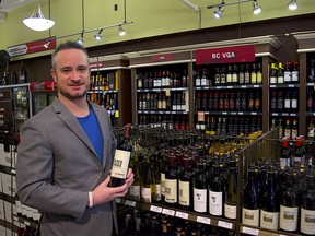 Butiq Escapes CEO Aidan Henry, picking out a few bottles of BC wine to send to a few favourite clients "suffering" in Alberta. (provided)