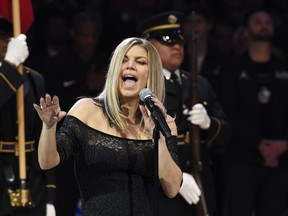 Singer Fergie performs the national anthem prior to an NBA All-Star basketball game, Sunday, Feb. 18, 2018, in Los Angeles.