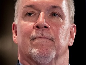 British Columbia Premier John Horgan participates in a question and answer session after giving a post-budget address to the Greater Vancouver Board of Trade in Vancouver, B.C., on Friday February 23, 2018. THE CANADIAN PRESS/Darryl Dyck ORG XMIT: VCRD116