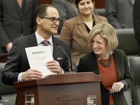 Alberta Finance Minister Joe Ceci and Premier Rachel Notley in the Alberta Legislature after tabling the 2017 provincial budget on March 16, 2017.