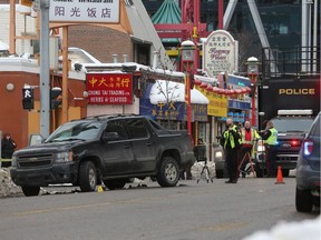 Police closed down Centre Street at 3rd street S.E. in downtown Calgary on Tuesday morning February 13, 2018 after a serious collision between an SUV and a pedestrian. Gavin Young/Postmedia