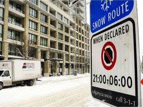 A snow route parking ban sign.