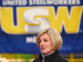 Alberta Premier Rachel Notley (R) speaks with steel workers, company representatives and media following a tour of Tenaris, a manufacturer and supplier of steel pipe products in Calgary on Friday, February 9, 2018. Jim Wells/Postmedia