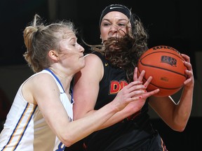 Brianna Ghali gets it going for the host Calgary Dinos against the Victoria Vikes at the Jack Simpson Gym on Saturday, Feb. 17, 2018