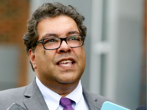 Calgary Mayor Naheed Nenshi speaks to media after voting at an advance voting station set up on a transit bus at the Kerby Center in downtown Calgary on Tuesday October 10, 2017.