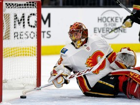 Calgary Flames goalie David Rittich clears the puck after a Vegas Golden Knights goal during the first period of an NHL hockey game Wednesday, Feb. 21, 2018, in Las Vegas.