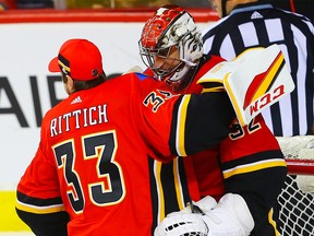 Calgary Flames goaltender Jon Gillies celebrates with teammate David Rittich after a 5-1 victory over the Colorado Avalanche during NHL hockey at the Scotiabank Saddledome in Calgary on Saturday, February 24, 2018.