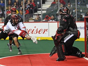 Roughnecks' Tyler Burton takes a shot on Vancouver Stealth goaltender Brodie MacDonald.