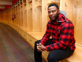 CFL player Charleston Hughes poses in the Calgary Stampeder locker room in Calgary on Friday, February 2, 2018. The veteran player was traded Friday from the Stampeders to the Hamilton Tiger-Cats and then a few minutes later traded to the Saskatchewan Roughriders. Jim Wells/Postmedia